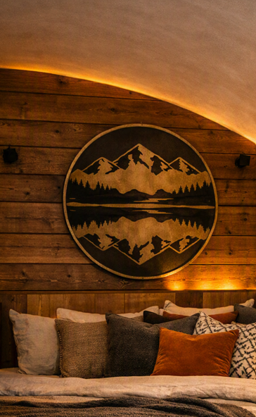 Double bed and sleeping area inside Tinkers Lodge